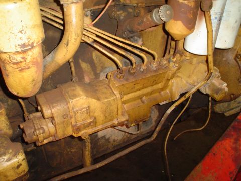 1966 International School Bus - This image shows a close-up view of an engine's fuel injection pump and associated lines.