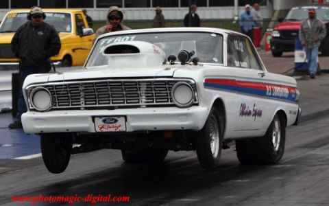 1972 Ford Ranchero - This modified Ford Falcon is seen during a drag race, with its front wheels off the ground.