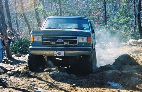 1990 Ford Bronco - Hung on my rear diff, smoking all 4 tires and slinging rocks.