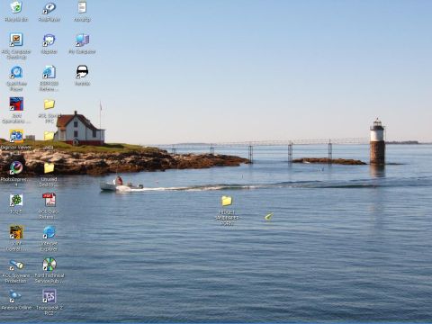 1993 Ford Bronco - A desktop screenshot captures a scenic view of a lighthouse and a boat sailing on the water under a clear blue sky.