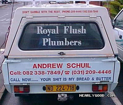 1989 Ford Bronco - This pickup truck features advertising for 'Royal Flush Plumbers' on its rear and camper shell.