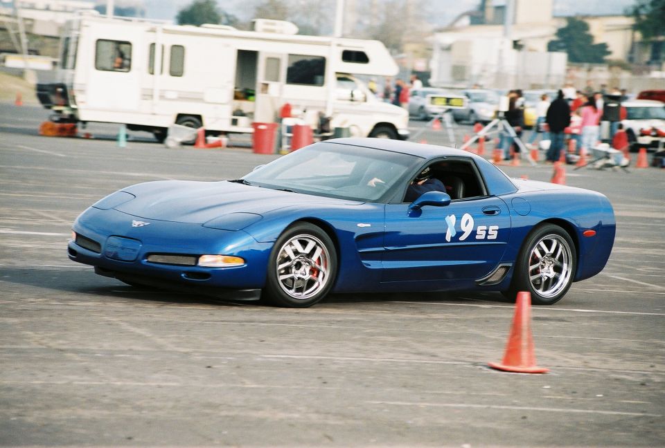 Blue Corvette C5 with racing numbers 1955 on door