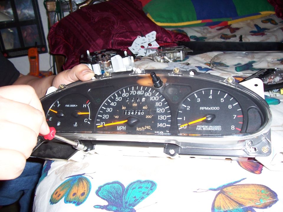 Car's instrument cluster with speedometer, tachometer, fuel, and temp gauges. Odometer shows 134790 miles