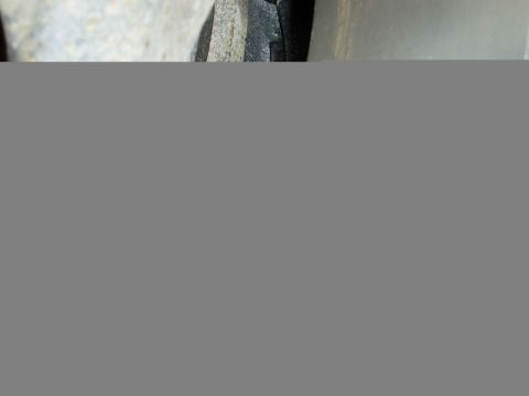 2000 Ford E350 - A close-up view of a vehicle's frame, showing structural components.