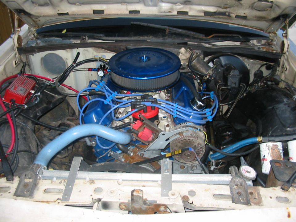 Engine bay with blue air filter and blue spark plug wires