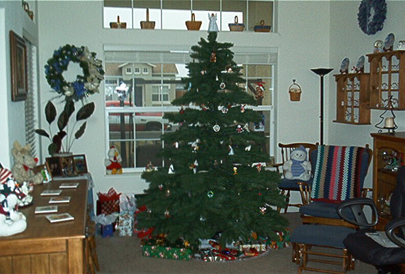Interior scene with a decorated Christmas tree and presents