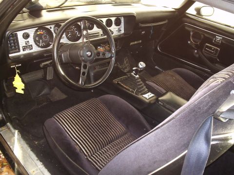 1979 Pontiac Trans Am - Interior view of a car, showing the dashboard, steering wheel, seats, and center console.