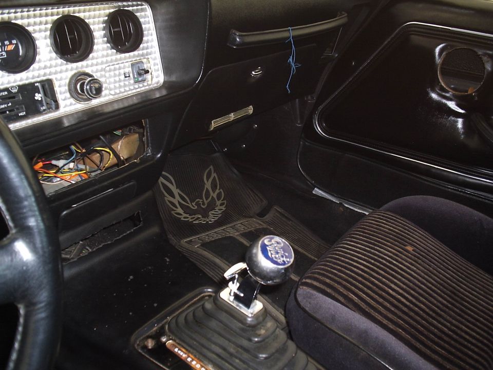 1979 Pontiac Trans Am interior with bird floor mats and shifter