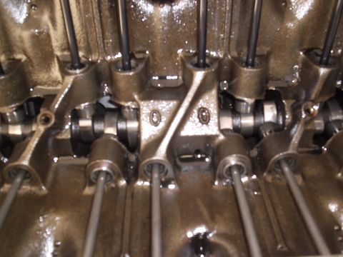 1979 Pontiac Trans Am - Internal view of an engine's valve train, showing pushrods and rocker arms in detail.