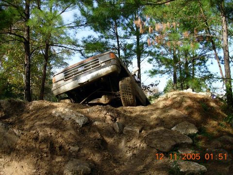 1987 Ford Bronco - 1987 Ford Bronco navigating a challenging off-road course.