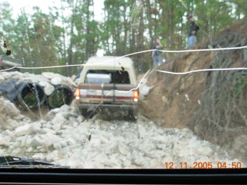1987 Ford Bronco - 1987 Ford Bronco navigating a rocky off-road trail.