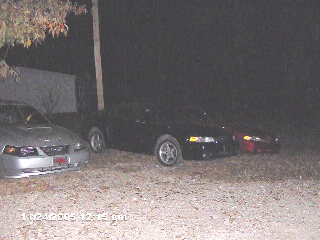 Silver 1999 Ford Mustang front view, parked at night