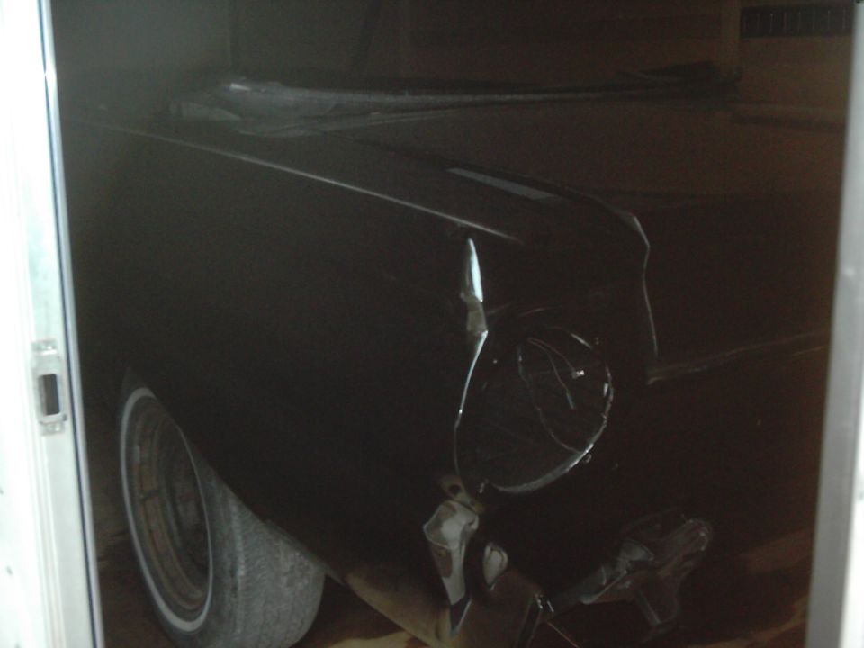 Black 1964 Ford Falcon convertible with whitewall tires, seen from a 3/4 front angle