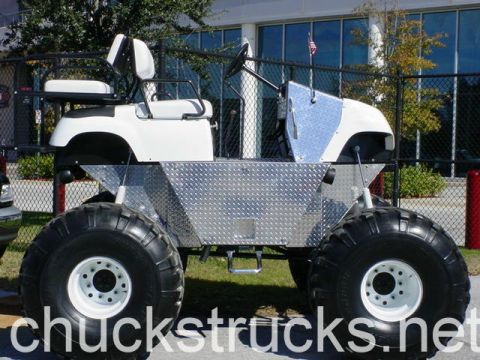 1991 Ford Bronco - This custom golf cart features oversized tires and a diamond plate body, unlike a 1991 Ford Bronco.