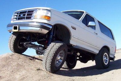 1995 Ford Bronco - This 1995 Ford Bronco is shown with an elevated suspension system on a sandy incline.