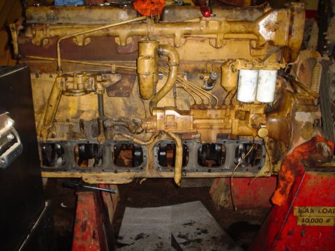 1966 International School Bus - This engine appears to be a heavy-duty diesel, but its specific make and model year are not visually identifiable.