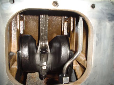 1966 International School Bus - Close-up view of engine crankshaft and connecting rods within the engine block.