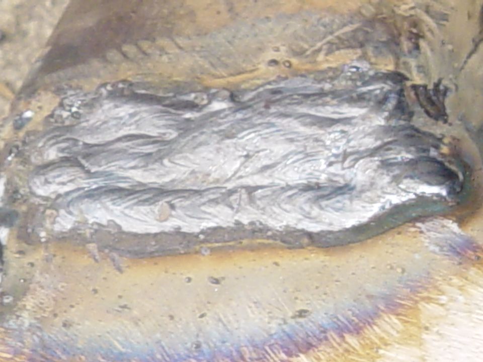 close-up of a metal weld seam with discoloration