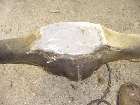 1989 Ford Bronco - A differential housing shows a large, rough weld patch on its upper surface.