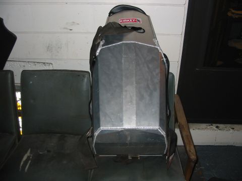 1985 Ford Crown Victoria LTD - A metal object with a "KIRKEY" logo is placed on a seat, with another seat visible beside it.