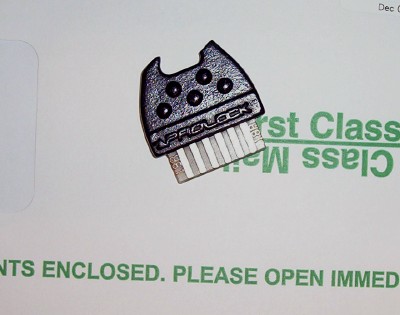1995 Ford Bronco - A black key fob, labeled 'AIRLOCK', is shown against a background of mail-related text.