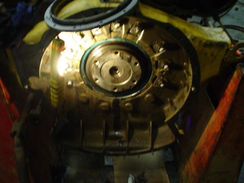1966 International School Bus - Engine bell housing and flywheel assembly, likely during maintenance or repair.