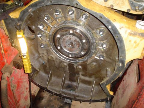 1966 International School Bus - This image shows a close-up view of a disassembled engine bell housing, revealing internal components and a gasket.