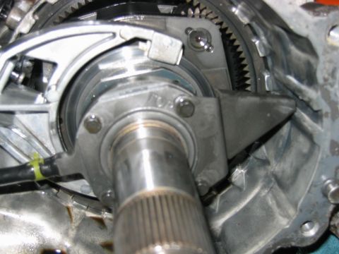 1992 Ford Bronco - Detail of a transmission's splined output shaft, ring gear and internal components during disassembly.