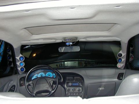 1995 Ford Probe - The dashboard and interior of a car are visible, multiple aftermarket gauges and a sunroof.