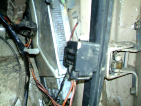 1987 Ford Bronco II - The inertia switch and associated wiring are visible in this close-up view.