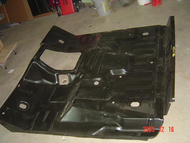 Yep, new floor. Old one had cracked (frequent problem) and was fixed once. 
Rust was coming and all the seatbelt nuts were gone......so it was time to replace.