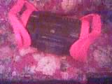 1986 Ford Bronco - A black car stereo is secured with bright pink straps, resting on a floral patterned surface.