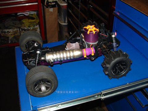 1994 Ford Bronco - This remote control buggy features a prominent purple engine and a ribbed silver exhaust system.
