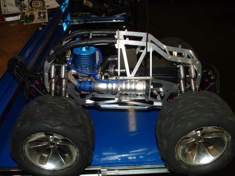 1994 Ford Bronco - This is a close-up view of a remote-controlled monster truck, highlighting its engine and suspension system.