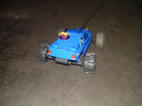 1994 Ford Bronco - A blue remote control monster truck with a Ford logo is shown from the rear.