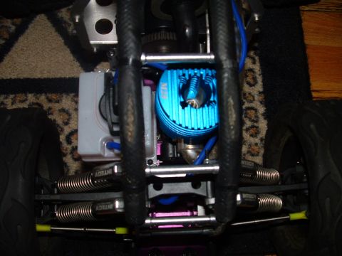 1994 Ford Bronco - Close-up view of a remote control car's engine and suspension system.