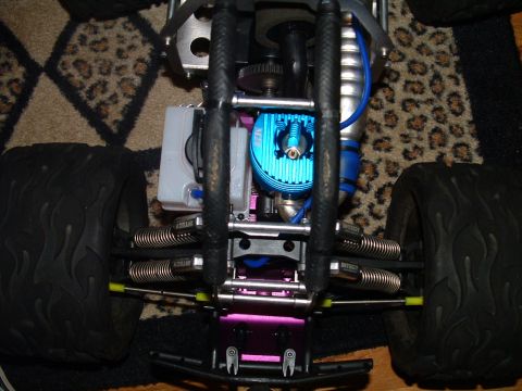 1994 Ford Bronco - RC car engine and suspension detail with large off-road tires visible.