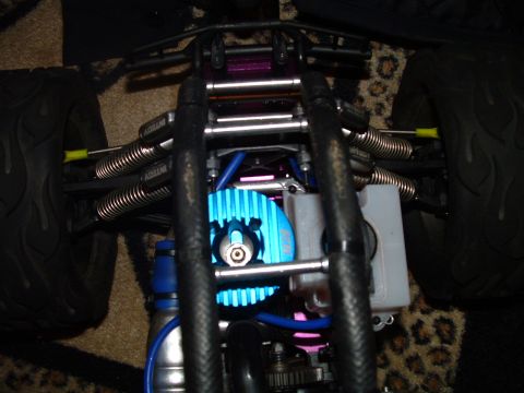 1994 Ford Bronco - Close-up view of a remote control car's engine and suspension system.
