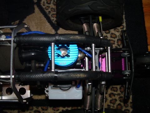 1994 Ford Bronco - The engine of a remote control car is shown, with intricate mechanical parts and suspension system.
