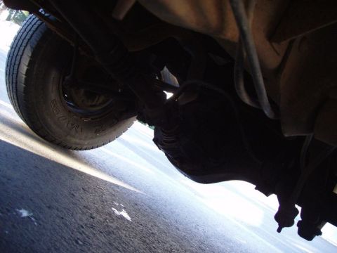 1985 Ford Bronco - My leaky rear. (note the fresh oil on the ground below it)