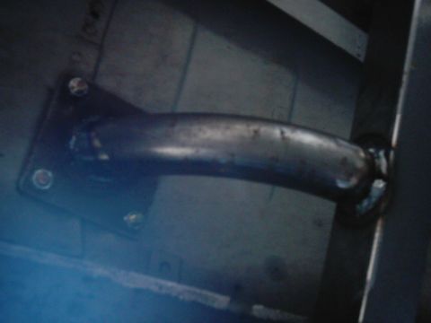 1978 Ford Bronco - A metal bracket and pipe assembly is shown, possibly part of a vehicle's exhaust or suspension system.