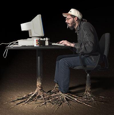 1989 Ford Bronco - A man wearing a white cap and glasses sits at a desk using an old CRT computer, with a cigarette in his mouth; his legs comically morph int…