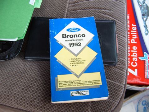 1993 Ford Bronco - The owner's manual for a 1992 Ford Bronco is visible on the seat of a vehicle.