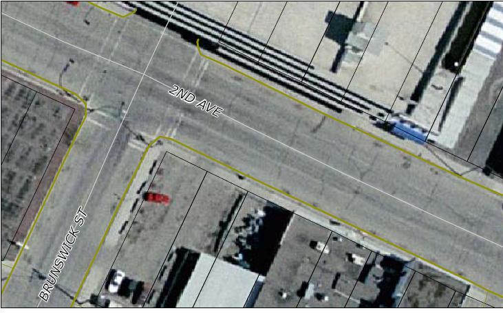 Aerial map screenshot of the 2nd Ave and Brunswick St intersection with parcel overlays