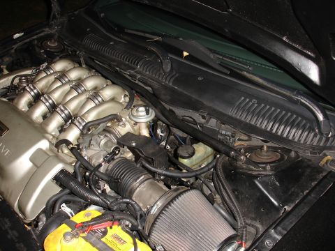 1993 Ford Taurus - Engine bay details including intake manifold, battery, and air filter.