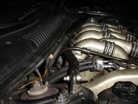 1993 Ford Taurus - Engine bay detail shot showing intake manifold, hoses, and wiring.