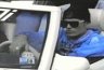 1992 Ford Probe - A man with sunglasses and a blue hoodie is seen inside a white vehicle.