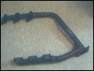 1992 Ford Probe - A black car part is shown with the Supermotors logo and website printed on it.