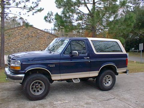 1992 Ford Bronco - This 1992 Ford Bronco is shown from the side, a two-tone blue and tan paint scheme.