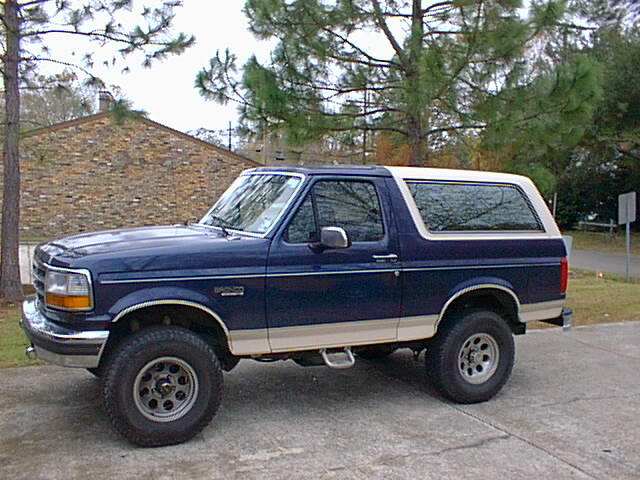 Blue and tan 1992 Ford Bronco side view